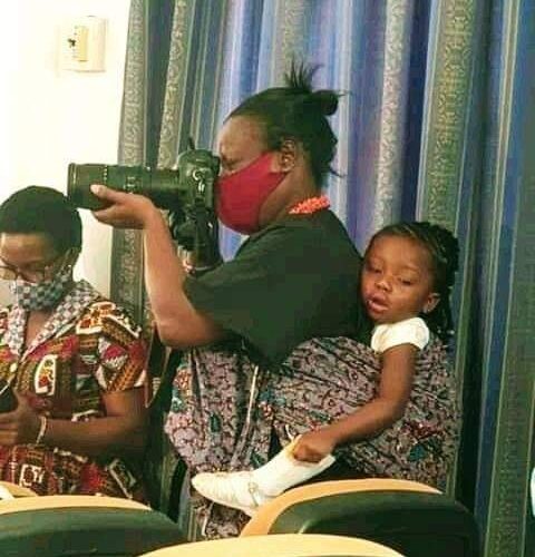 Meet The Female Photographer Who Works With Her Daughter At Her Back